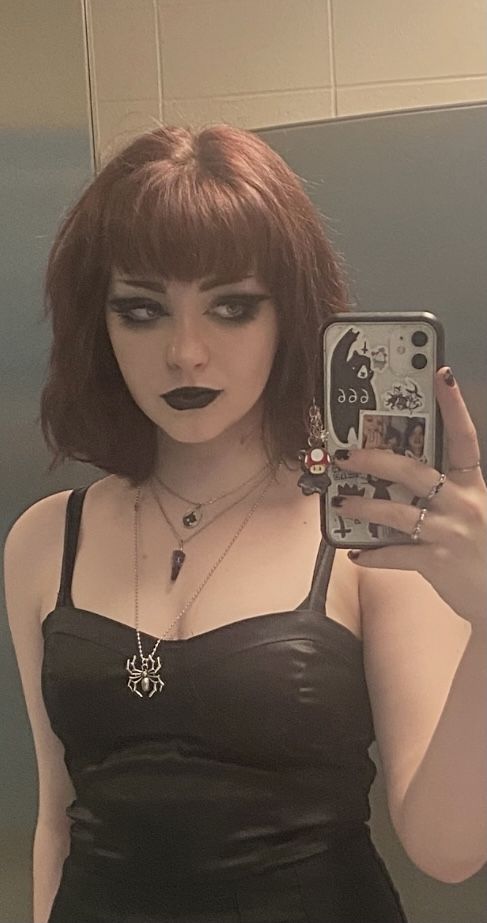 1girl, female only, white female, medium hair, brown hair, makeup, selfie, fringe, pale skin, non-nude, light skin, black clothes, necklace, clothed, pale, mirror selfie, goth, black lipstick, alt girl, dress, lipstick